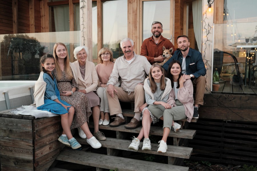 Multi-generational family portrait together at home
